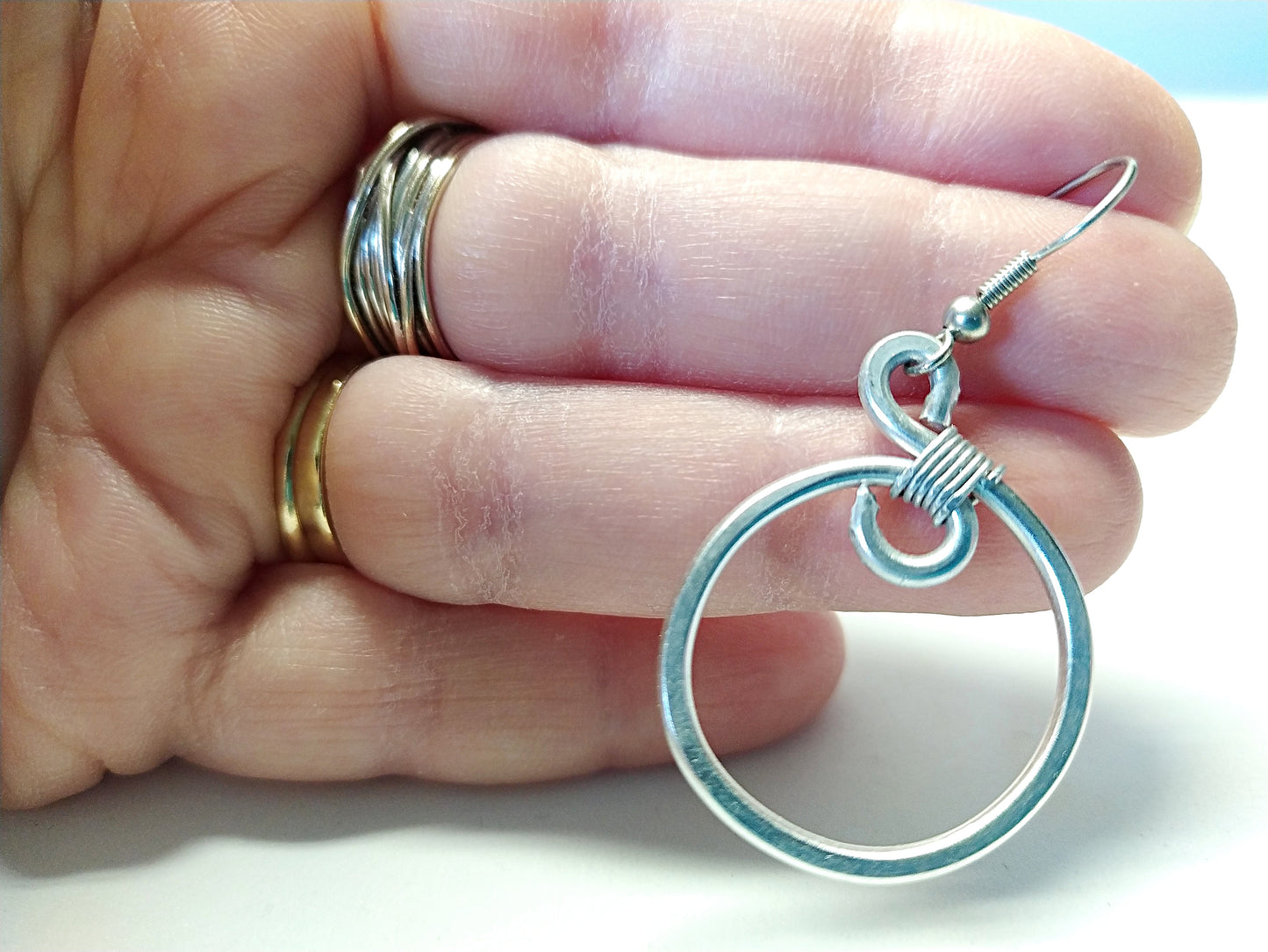 Big silver aluminum spiral earrings. Aluminium dangle celtic earrings. Contemporary jewelry