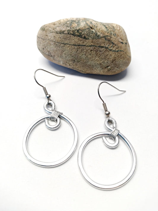 Big silver aluminum spiral earrings. Aluminium dangle celtic earrings. Contemporary jewelry