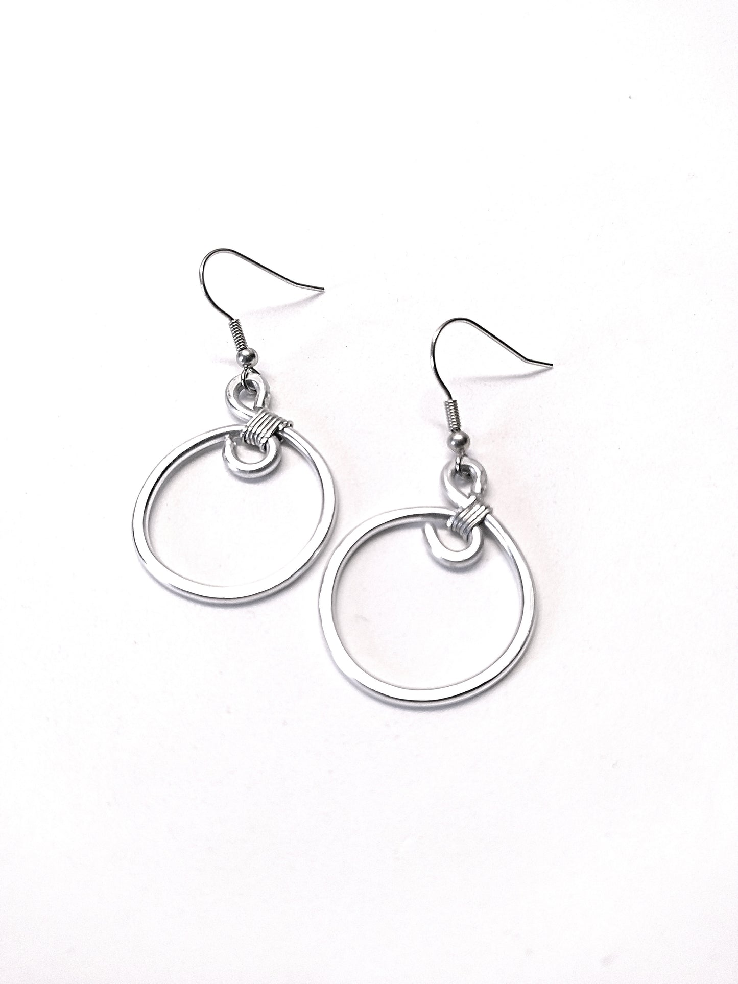 Big silver aluminum spiral earrings. Aluminium dangle celtic earrings. Contemporary jewelry