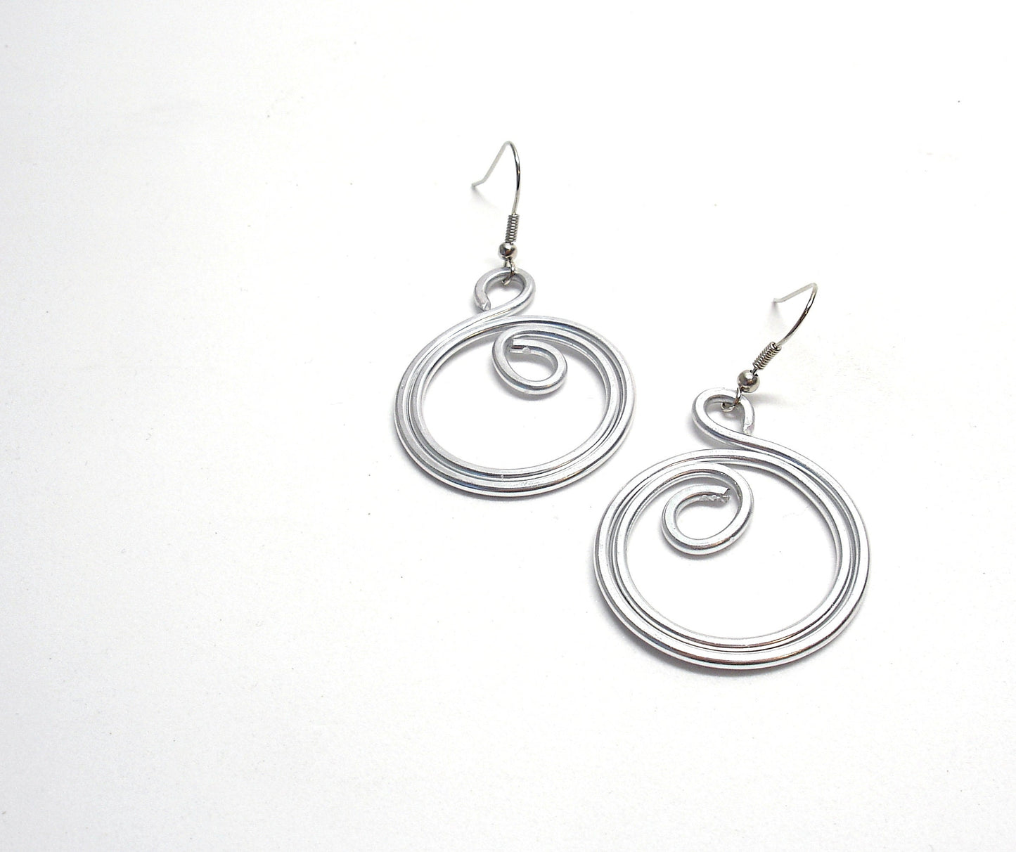 Big silver aluminum spiral earrings. Aluminium dangle celtic earrings. Contemporary jewelry. Christmas gift for her