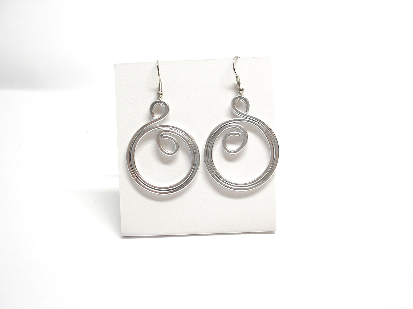 Big silver aluminum spiral earrings. Aluminium dangle celtic earrings. Contemporary jewelry. Christmas gift for her
